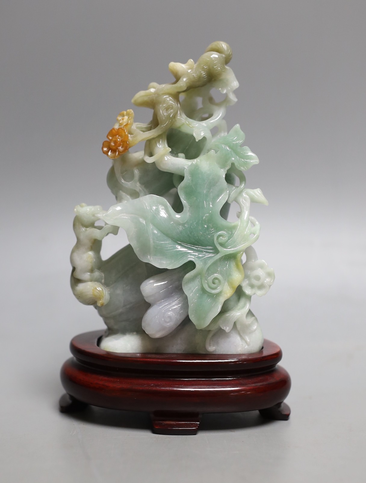 A Chinese jadeite carving of bitter melons on hardwood stand 16cm